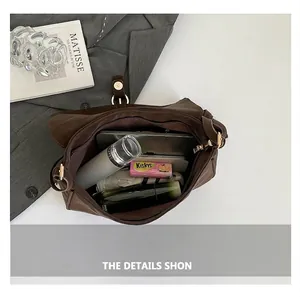Spacious interior of a vintage dark brown leather tote bag with daily essentials