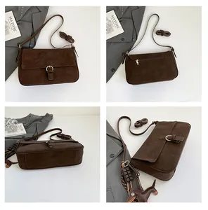 Detail view of retro brown crossbody bag with matte finish and dog charm details
