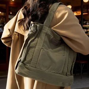 Olive green canvas tote bag with large capacity for daily commuting and student use