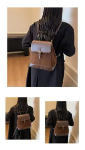 Detail showing vintage brown suede and leather splicing texture of the casual backpack