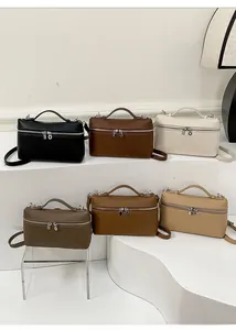 Litchi pattern leather handbags in six colors displayed on minimalist white stands