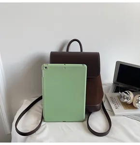 Detail showing the brown suede backpack interior space fits an 11-inch tablet