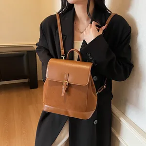 Chic brown retro faux suede and leather拼接 casual backpack shown on model