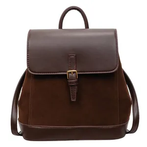 Deep brown faux suede and leather backpack with gold buckle and top handle for women