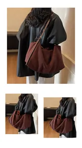 Close-up of deep burgundy suede tote bag showing soft matte texture and adjustable strap
