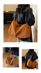 Detail of caramel brown matte suede tote bag showing soft texture and large capacity