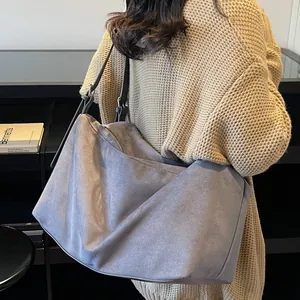 Minimalist grey faux suede oversized tote bag for women featuring long black shoulder straps