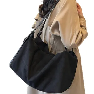 Minimalist large black matte tote bag for women showing a spacious commute shoulder style