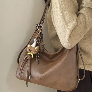 Brown vintage large capacity tote bag for women with a cute bear charm on shoulder