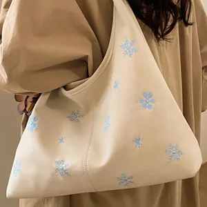Off-white large shoulder tote bag with blue snowflake embroidery for daily commute