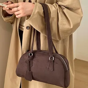 Minimalist dark brown suede bowling bag with silver hardware for women commuting