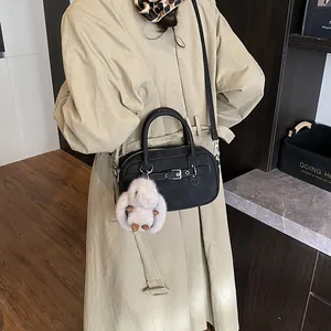 Vintage black crossbody square bag with metal buckle and plush rabbit charm accessory