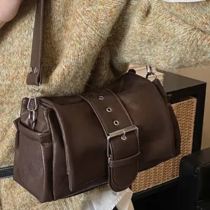 Minimalist dark brown rectangle shoulder bag with large silver buckle and wide strap