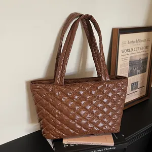 Stylish brown quilted puffer tote bag with large diamond stitching for daily fashion