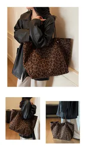 Detailed view of large leopard print tote bag with soft texture and slim shoulder straps