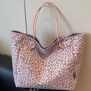 Pink leopard print suede tote bag with durable rope handles for daily office commute