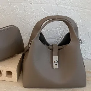 Minimalist dark khaki lychee leather bucket bag with silver metal buckle and pouch