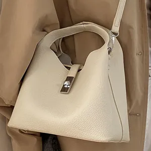 Retro cream litchi leather bucket bag with metal lock and adjustable shoulder strap