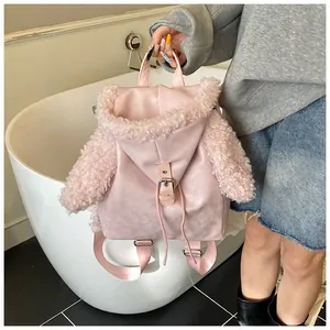 Pink plush backpack detail showing lamb wool splicing and metal buckle on side view