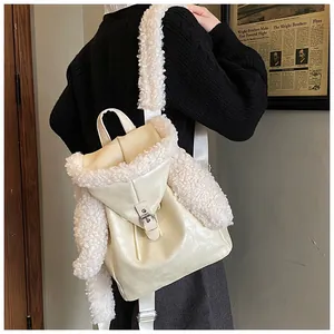 Detail view of cream plush backpack featuring cute rabbit ears and soft faux fur textures