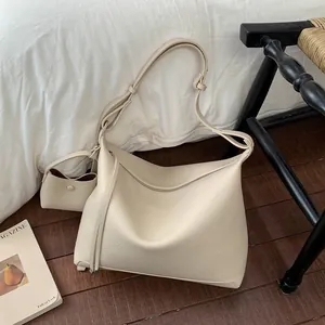 Minimalist cream white oversized tote bag in pebbled leather with small pouch