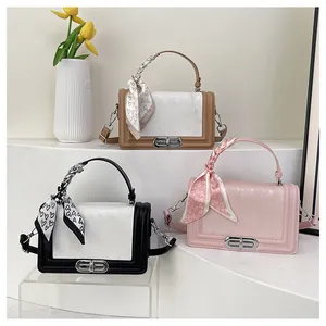 Leather crossbody square bags in three colors featuring scarf handles and metal locks