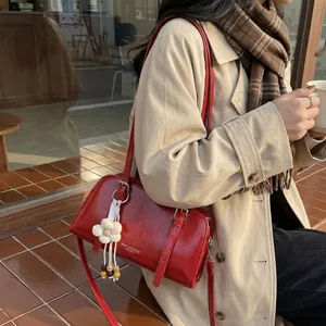 Retro burgundy rectangular shoulder bag with floral charm and HONGTONA logo on flap
