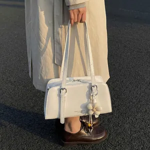 Minimalist cream white PU leather underarm tote bag with silver buckle and flower charm