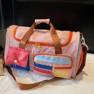 Pink large capacity travel bag with orange zippers and multi-pocket functional design