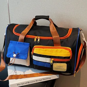 Versatile black travel duffel bag with colorful contrast pockets and Happy Weekend tag