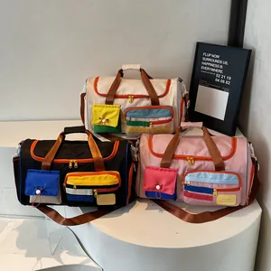 Stylish large capacity travel bags in black, beige, and pink colors with shoulder straps