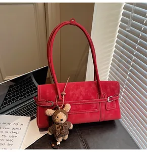 Deep red rectangular tote bag with white stitching and a cute teddy bear charm