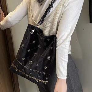 Vintage ethnic style black faux suede tote bag with heavy beadwork and scarf detail