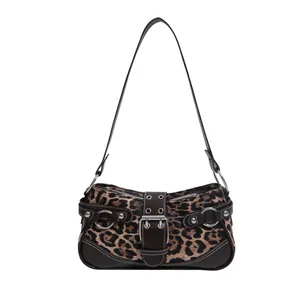 Retro leopard print shoulder bag with vintage buckle and rivet details on white background