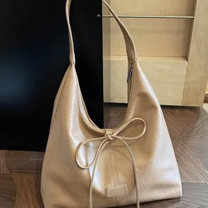 Retro khaki bow tote bag with large capacity and soft faux leather texture for women