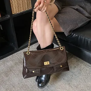 Quilted dark brown tote bag with gold chain strap and metallic finish leather