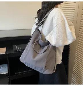 Detail of dark grey corduroy tote bag showing large capacity and soft texture for daily use