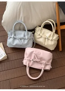 Chic leather bucket bags in blue, beige, and pink with pleated texture and belt buckles