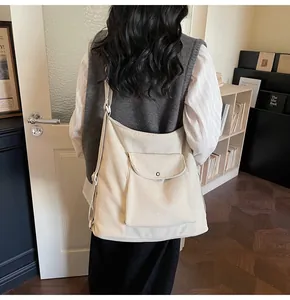 Detail of beige corduroy tote bag showing large capacity and soft texture in lifestyle setting