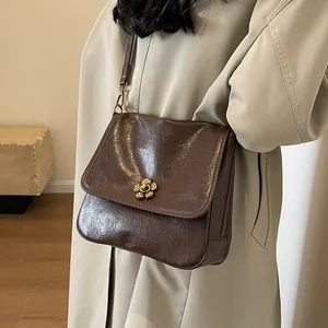 Vintage dark brown leather tote bag for women with golden flower clasp and slim shoulder strap