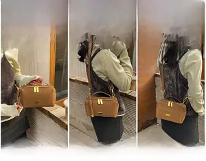 Three-way carry style of brown Boston bag showing hand-held, shoulder, and crossbody use