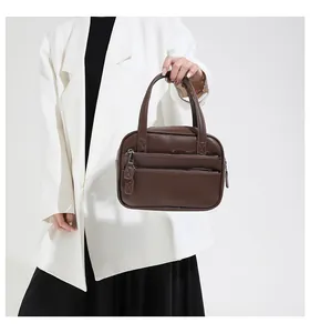Detailed macro view of high-quality brown litchi grain texture on formal briefcase