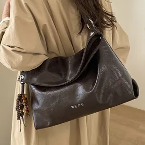Retro coffee PU leather tote bag with Korean print and wooden bead pendant detail
