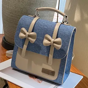 Retro denim backpack for women with beige bows and leather trim in blue and beige