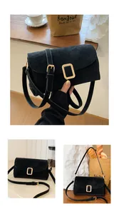 Detail of minimalist black suede crossbody bag with elegant gold buckle and adjustable strap
