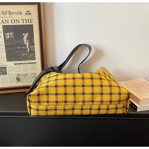 Close-up of yellow and black checkered canvas tote bag with retro vintage background