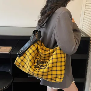 Yellow plaid canvas tote bag with heart embroidery and black wide shoulder strap