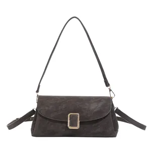 Minimalist rectangular crossbody bag in charcoal faux leather with gold buckle