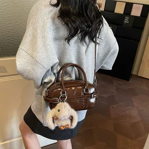 Vintage brown leather bowling bag with cute bunny pendant and detachable strap