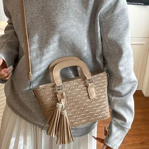 Chic beige ruched bucket bag with rhinestone tassel detail and detachable shoulder strap